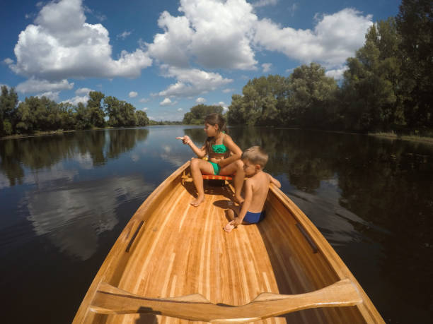 istock Kids in the canoe 1190349877
