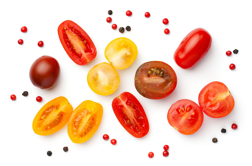 Fresh colorful cherry tomatoes isolated on white background. Red, yellow and brown tomato. Top view
