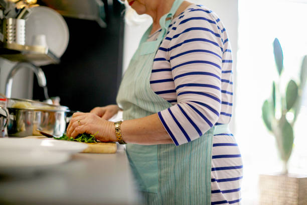 istock Senior woman chopping parsley 1190351408