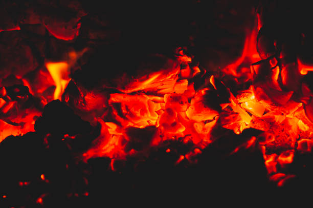 istock Beautiful red bright coals of bonfire. Close-up. 1190352422