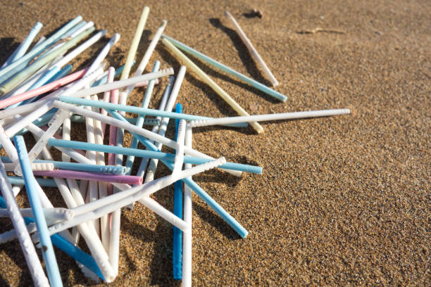 istock Lots of plastic ear sticks collected on the beach. Ocean plastic pollution concept. 1190352515