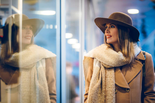 istock Beautiful woman window shopping 1190353960