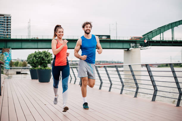 istock Athlete man and woman jogging 1190355328