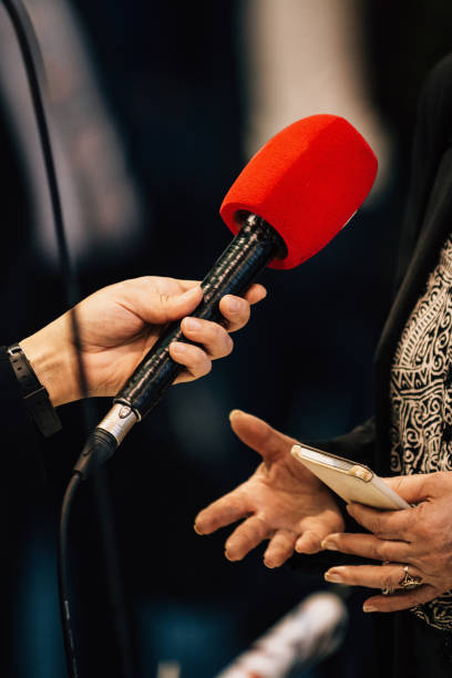 istock Journalist Interview. Businessman Speaker Answering Questions 1190355381