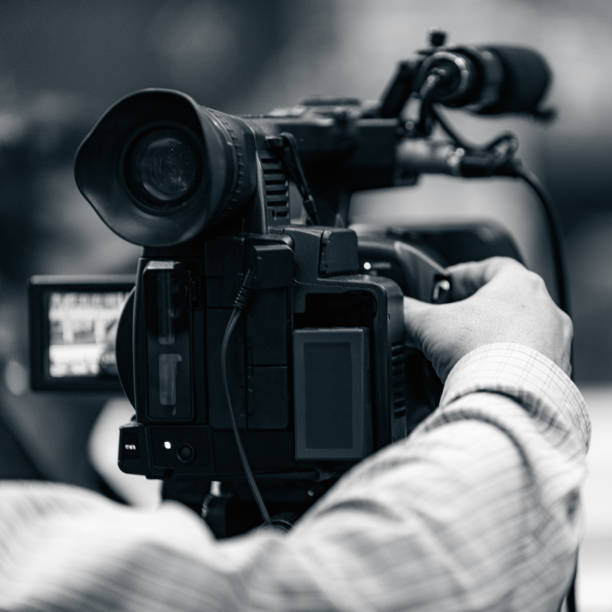 istock Cameraman Recording Event At Media Press Conference 1190356321