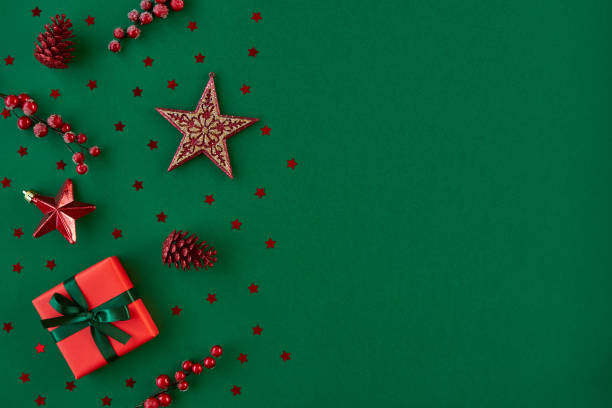 istock Christmas, New year composition. Gift box and holiday decorations on green background . Flat lay. Top view with copy space 1190357627