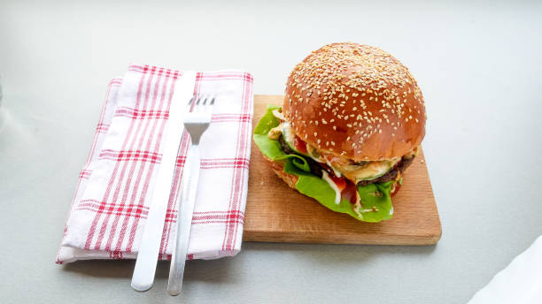 istock Meaty hamburger in a restaurant 1190357813
