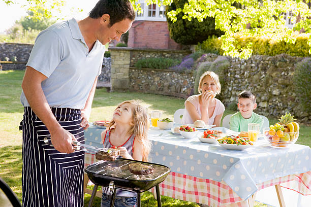 istock A family outside enjoying a barbecue  119035818