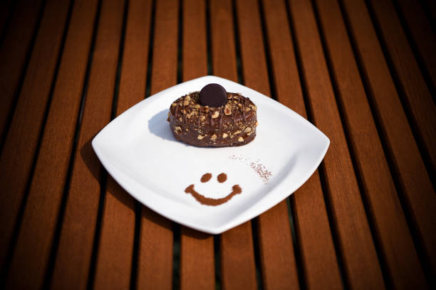 Beautifully decorated cake on a plate. Interestingly arranged dessert.