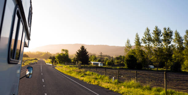 istock Camper van on open road in late afternoon 1190359448
