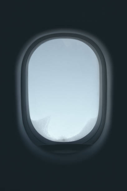 istock Window on the plane is frozen and cold 1190360073