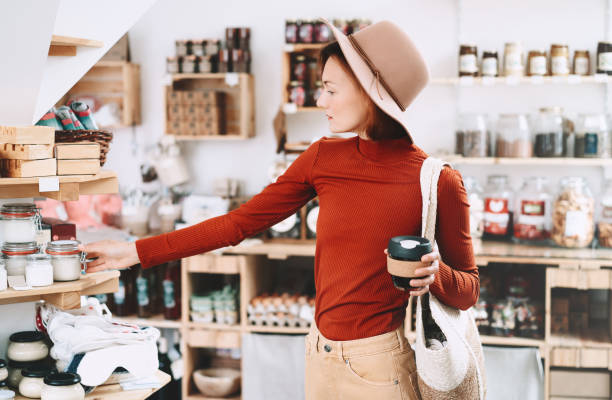 istock Young woman choosing products in zero waste shop. 1190360730