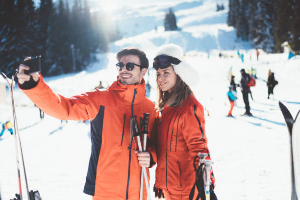 istock Couple on winter holiday taking selfie 1190361026