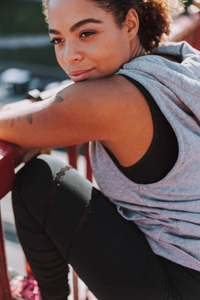 istock Beautiful young woman looking away and smiling 1190362875