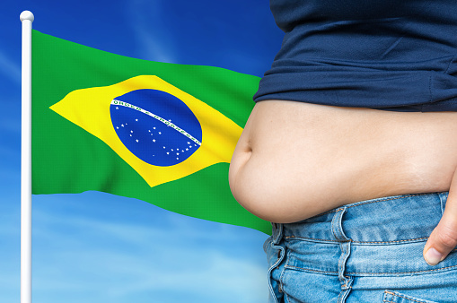 Obesity problem in Brazil. Overweight woman on background of national flag. 3D rendered illustration.