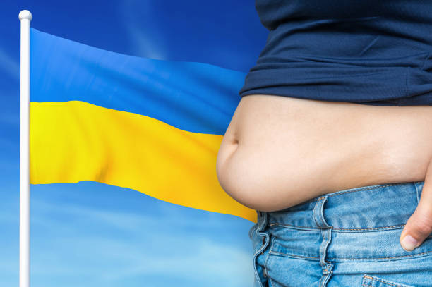 istock Obesity problem in Ukraine. Overweight woman on background. 1190364243