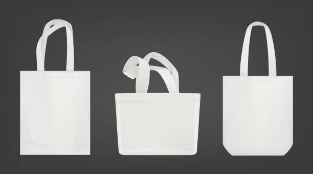 White tote shopping eco bags Tote shopping canvas bags. Vector mockup of realistic white reusable cotton ecobags different shapes isolated on gray background. tote bag mock up stock illustrations