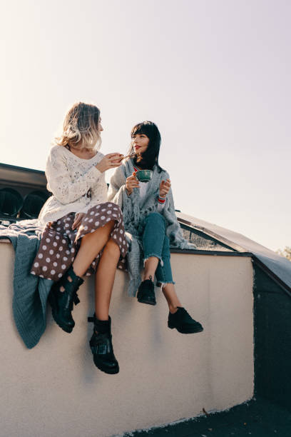 istock Two attractive girls enjoy a tea party 1190366895