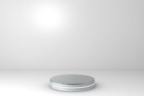 istock Round silver stage podium concept illustration isolated on white background. Festive podium scene for award ceremony on white. Silver pedestal for product presentation. 3d rendering 1190367119