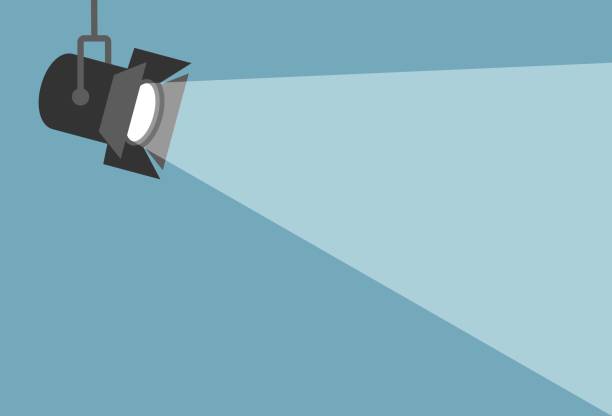 Spotlight shining flat illustration. Movie spotlight on blue background Spotlight shining flat illustration. Movie spotlight on blue background. Vector flat illustration spotlight illustrations stock illustrations