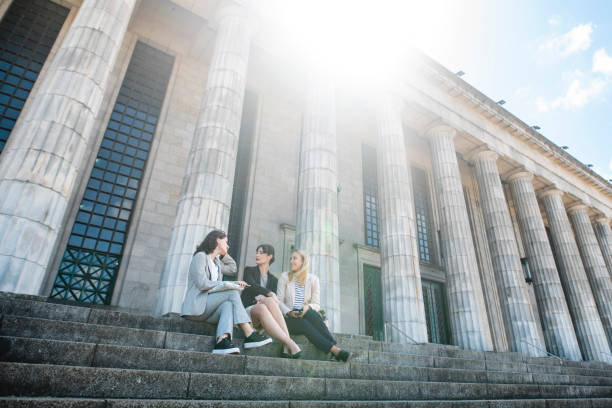 istock Young Female Law School Classmates Sitting and Conversing 1190367423