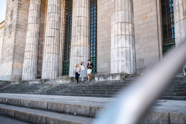 istock Young Female Law Students Exiting University Building 1190367430