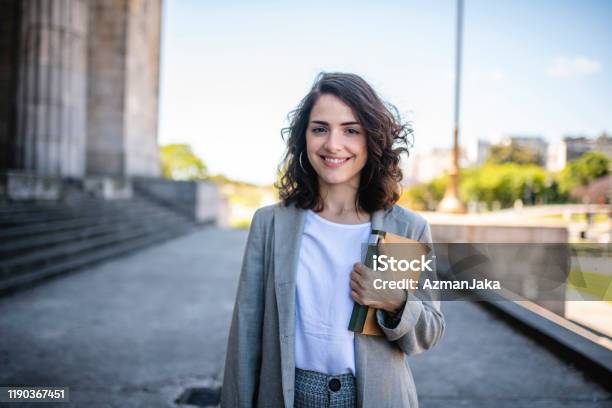 Law Student Standing At Entrance To University Building Stock Photo - Download Image Now