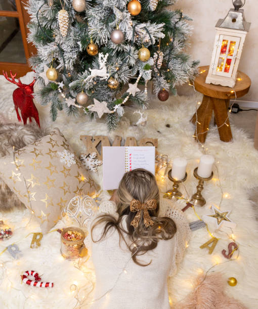 istock Woman makes her Christmas list 1190369700