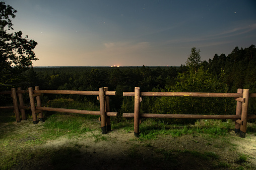 wooden fence at night on the meadow