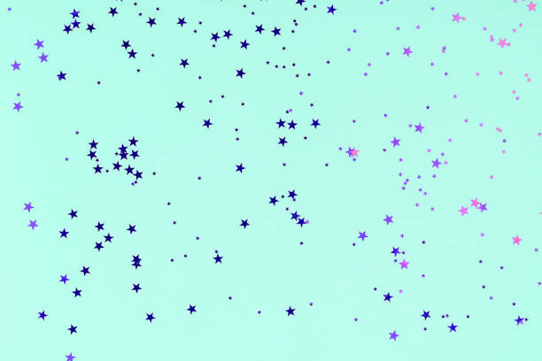 istock Violet Stars Glitter Confetti on mint background. Festive backdrop. 1190376561