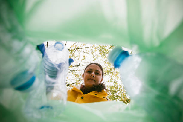 istock Volunteer collecting plastic bottles 1190378446