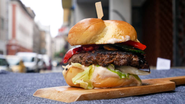 istock Meaty hamburger in a restaurant 1190380327