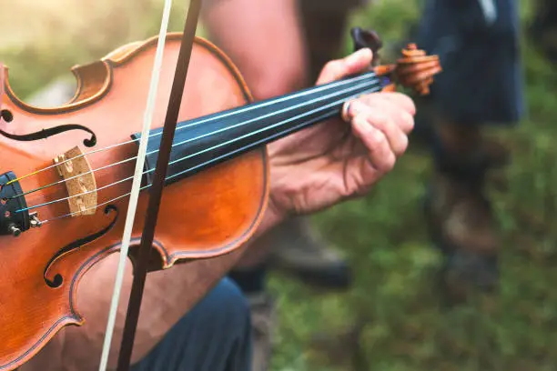 Photo of Violin played outdoors in a popular country party