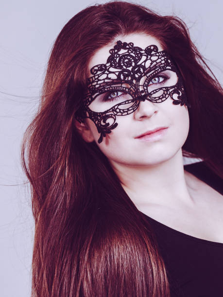 istock Mysterious woman wearing lace mask 1190381810