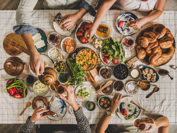 istock Flat-lay people sitting and having traditional Turkish breakfast with tea 1190381899