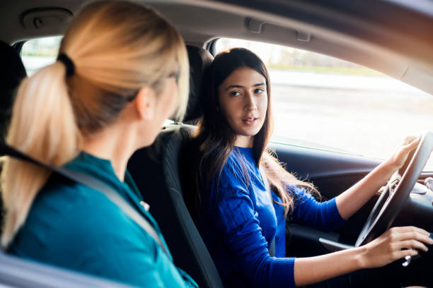 istock Teenager Having Driving Lesson With Female Instructor 1190383811