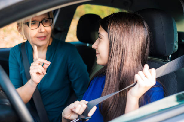 istock Teenager Having Driving Lesson With Female Instructor 1190383813