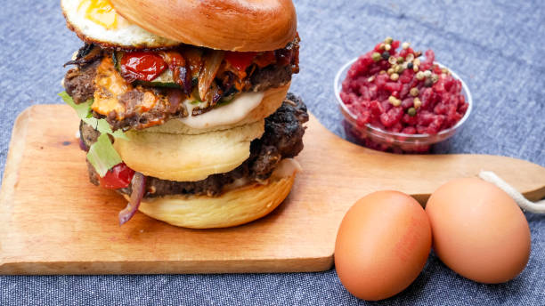 istock Meaty hamburger in a restaurant 1190383870