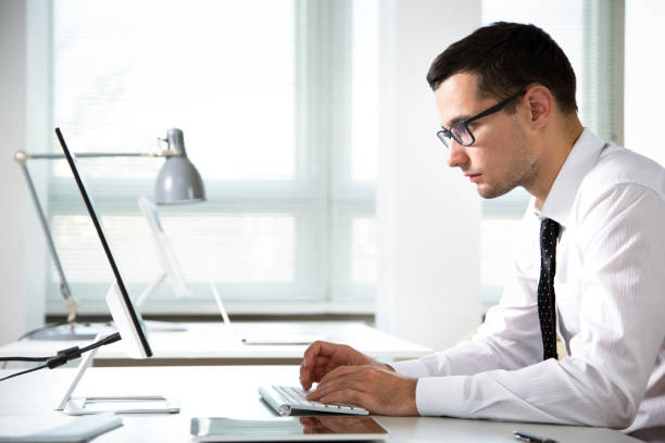 istock Young handsome businessman working in an office 1190383888