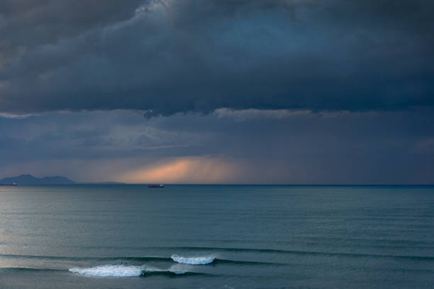 istock dark seascape with stormy clouds and some waves 1190384019