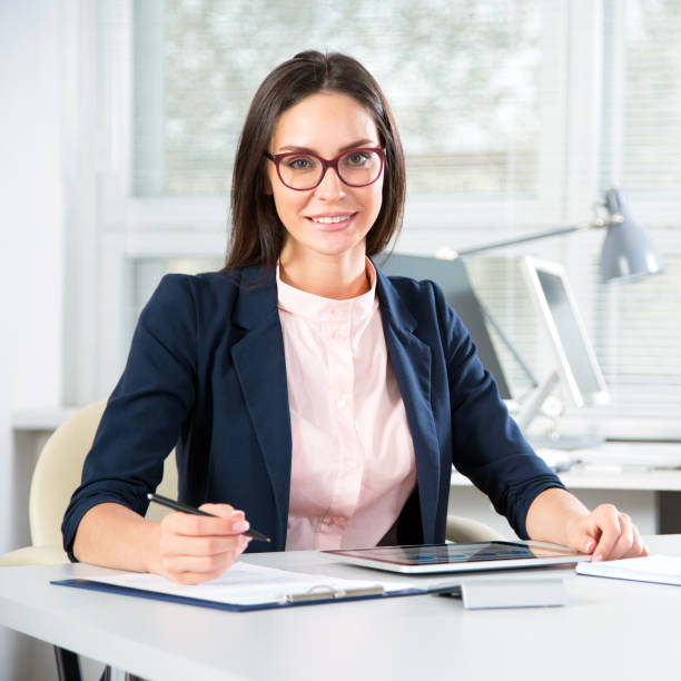 istock Young businesswoman in an office 1190384899