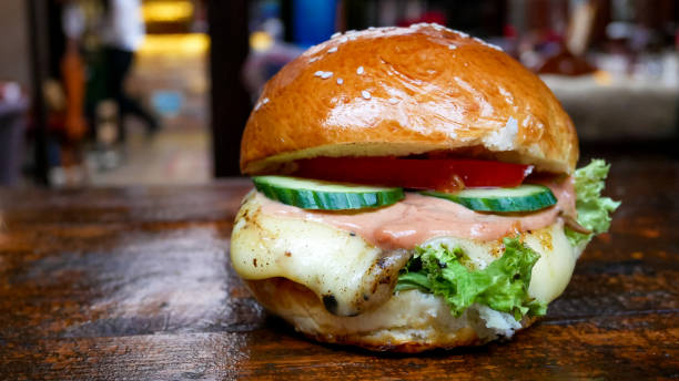 istock Meaty hamburger in a restaurant 1190385388