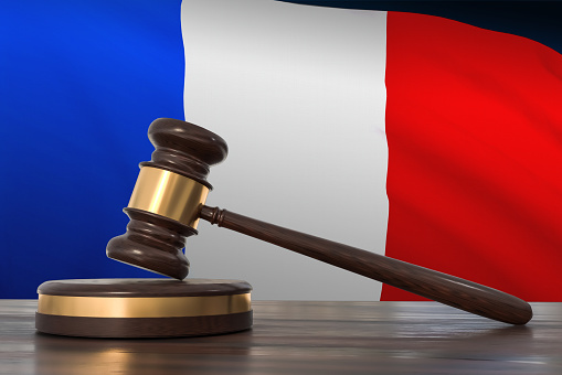 Justice in France. Wooden gavel in in lawyer office. 3D rendered illustration.