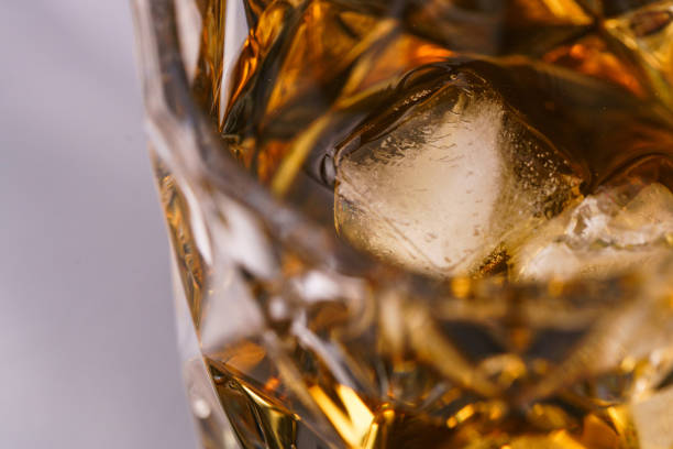 Glass of whiskey on dark table