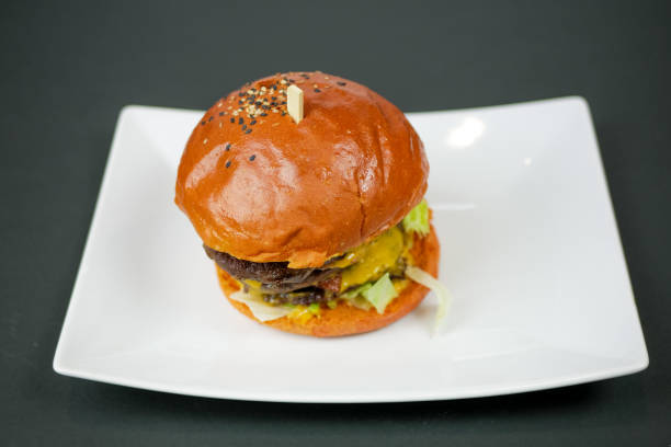 istock Meaty hamburger in a restaurant 1190390616