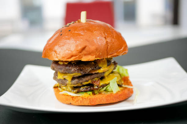 istock Meaty hamburger in a restaurant 1190390663