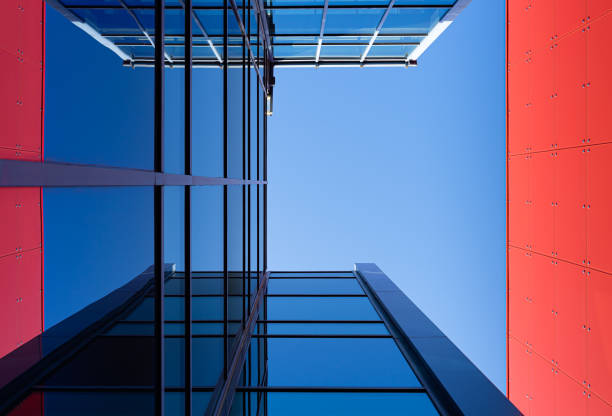 istock Directly Below Shot Of Modern Building Against Clear Blue Sky 1190391604