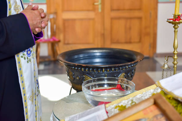 istock The priest performs the act of Orthodox baptism 1190392197
