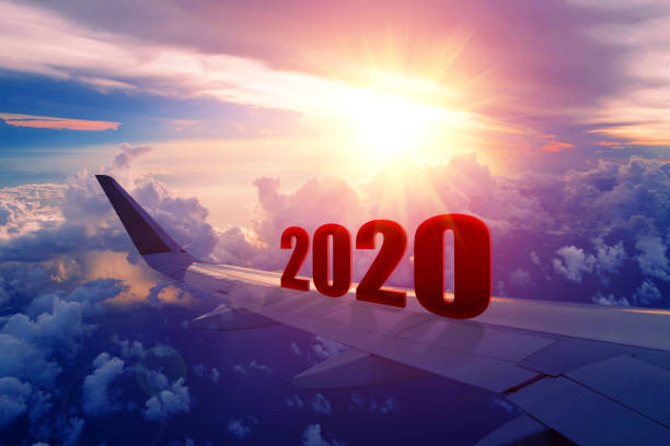 istock Airplane wing flying at sunrise in 2020 1190392415