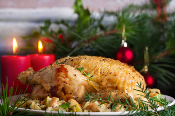 istock Roasted chicken with apple and bread stuffing. Christmas decorations. Dish for Christmas Eve. New Year food menu 1190392915